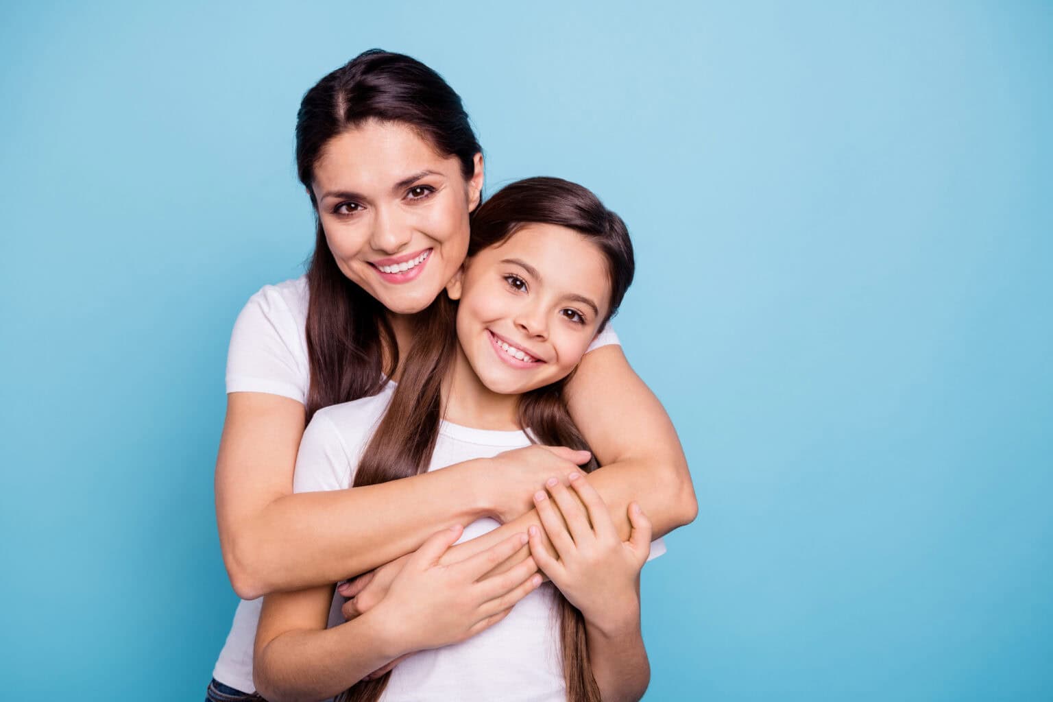 Mother and daughter smiling together